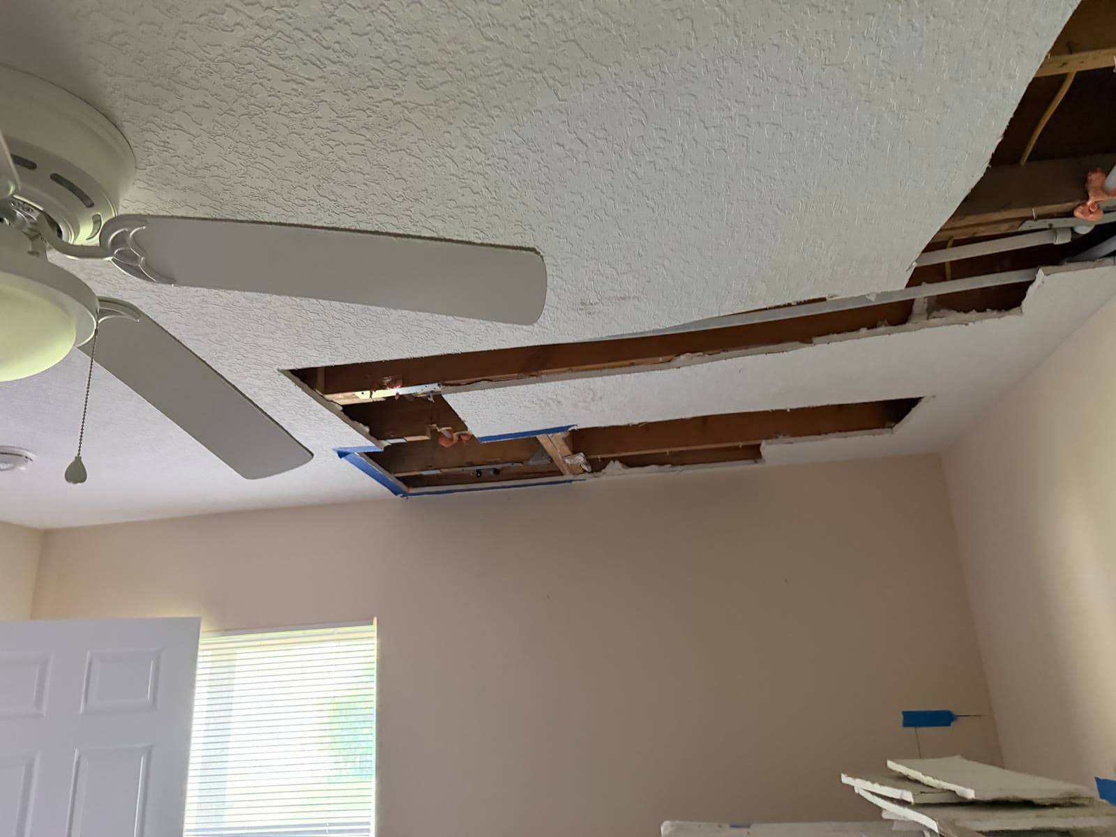 Multiple ceiling cutouts before drywall repair after repiping in Melbourne FL