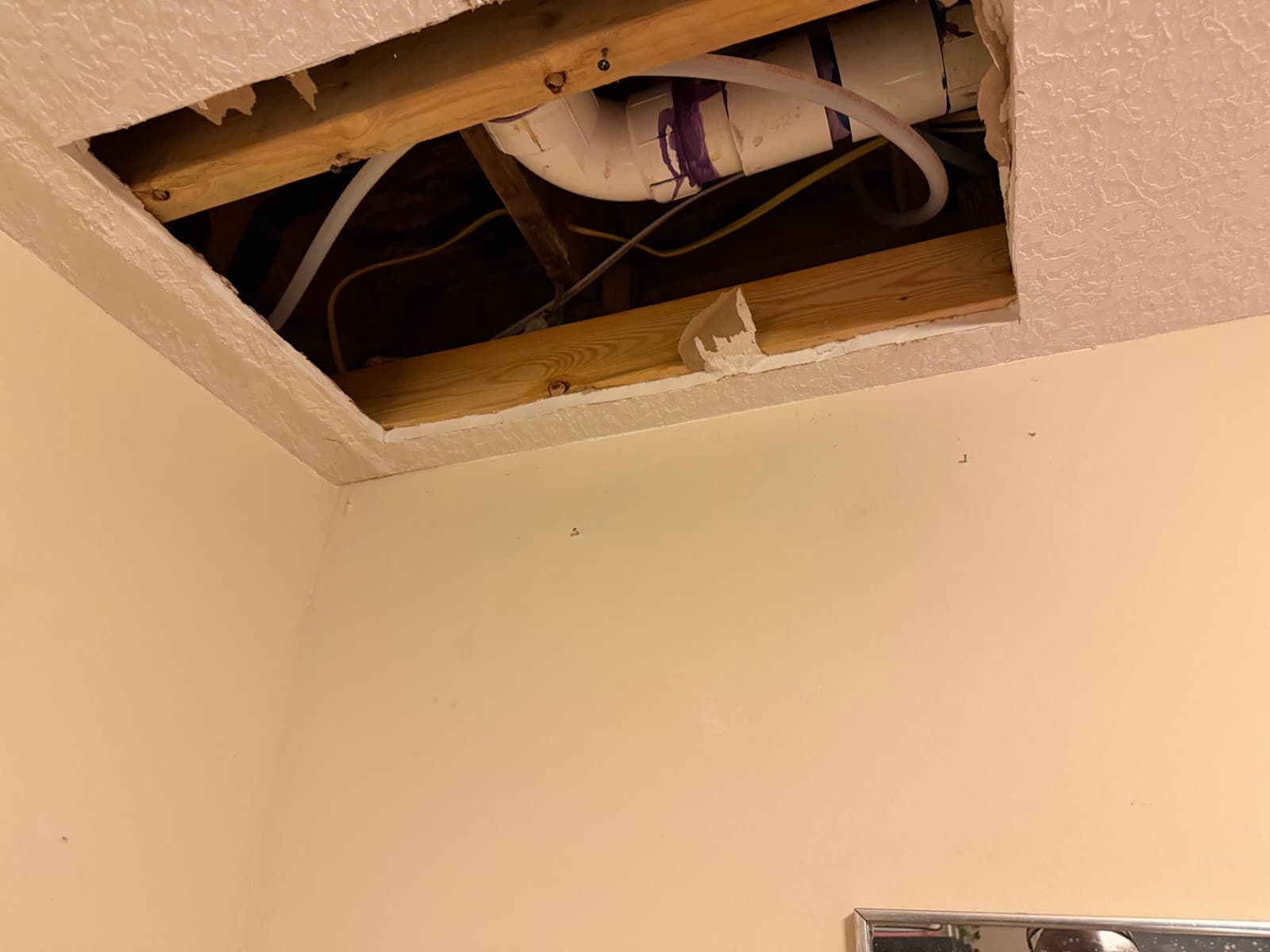 Ceiling plumbing opening before drywall repair in a Melbourne FL home