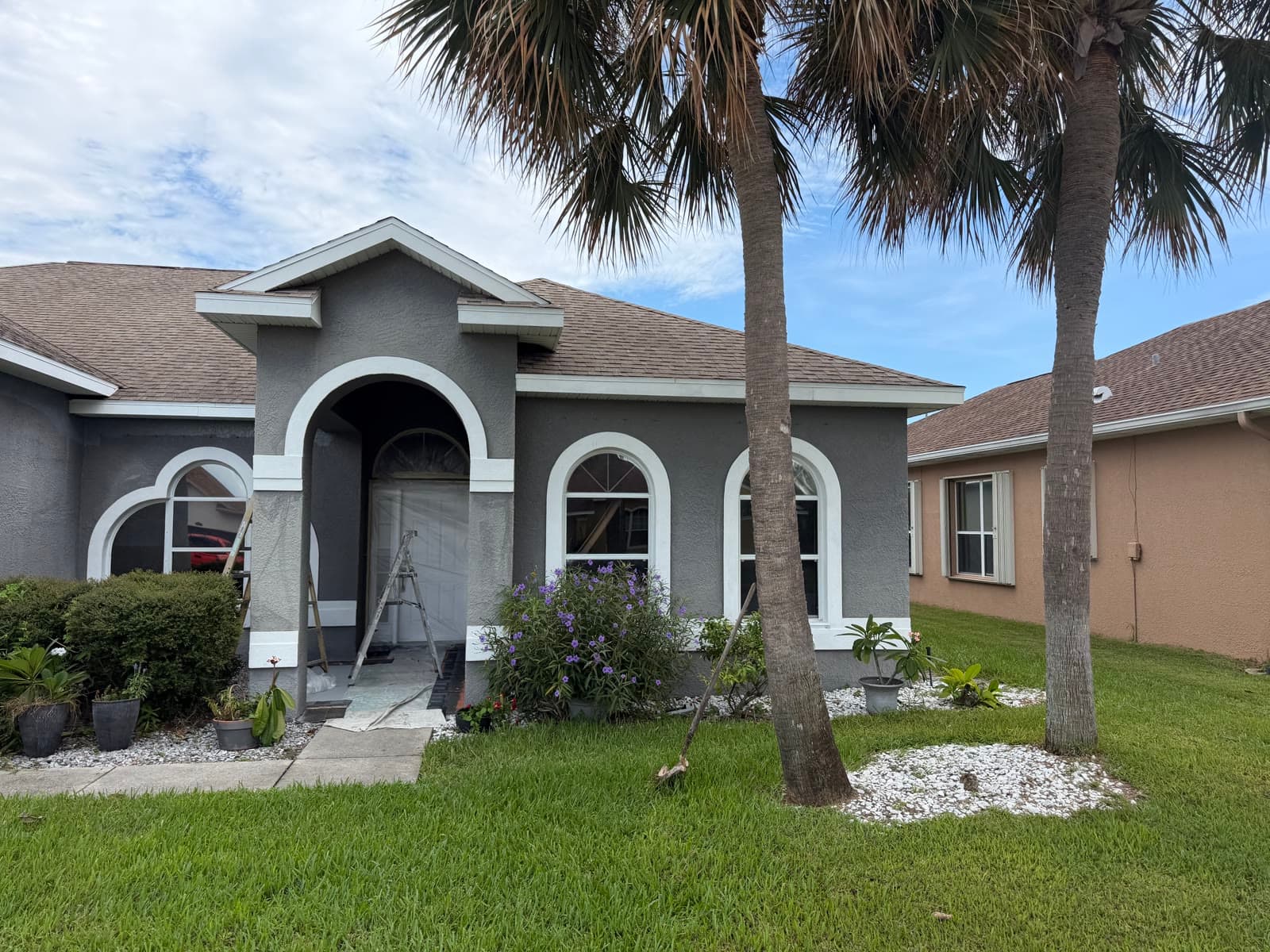 Viera Suntree FL home exterior after stucco repair and fresh exterior wall painting