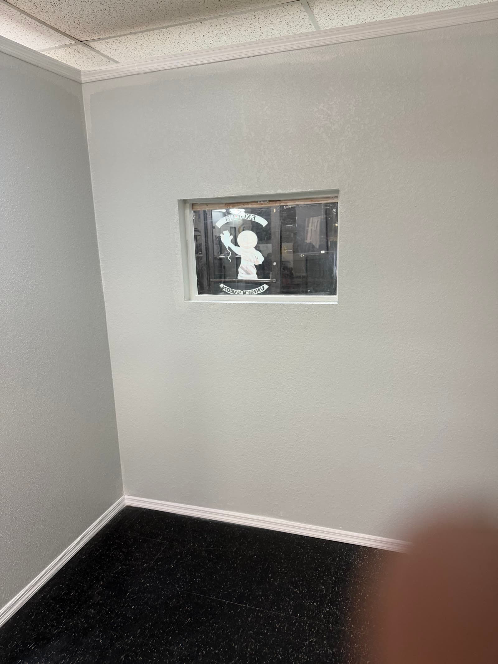 Completed interior window wall and trim in the Exodus Barbershop stylist room