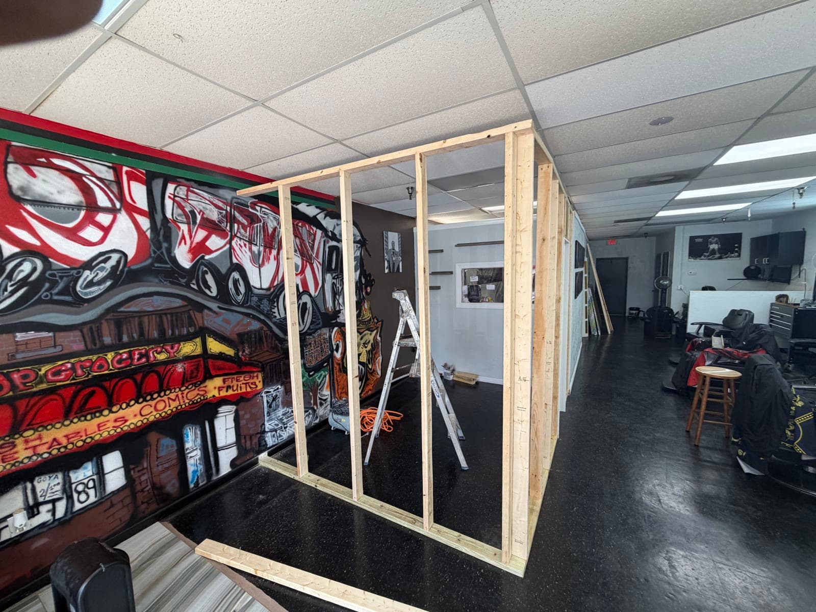 New stylist room wall framing at Exodus Barbershop in Palm Bay FL