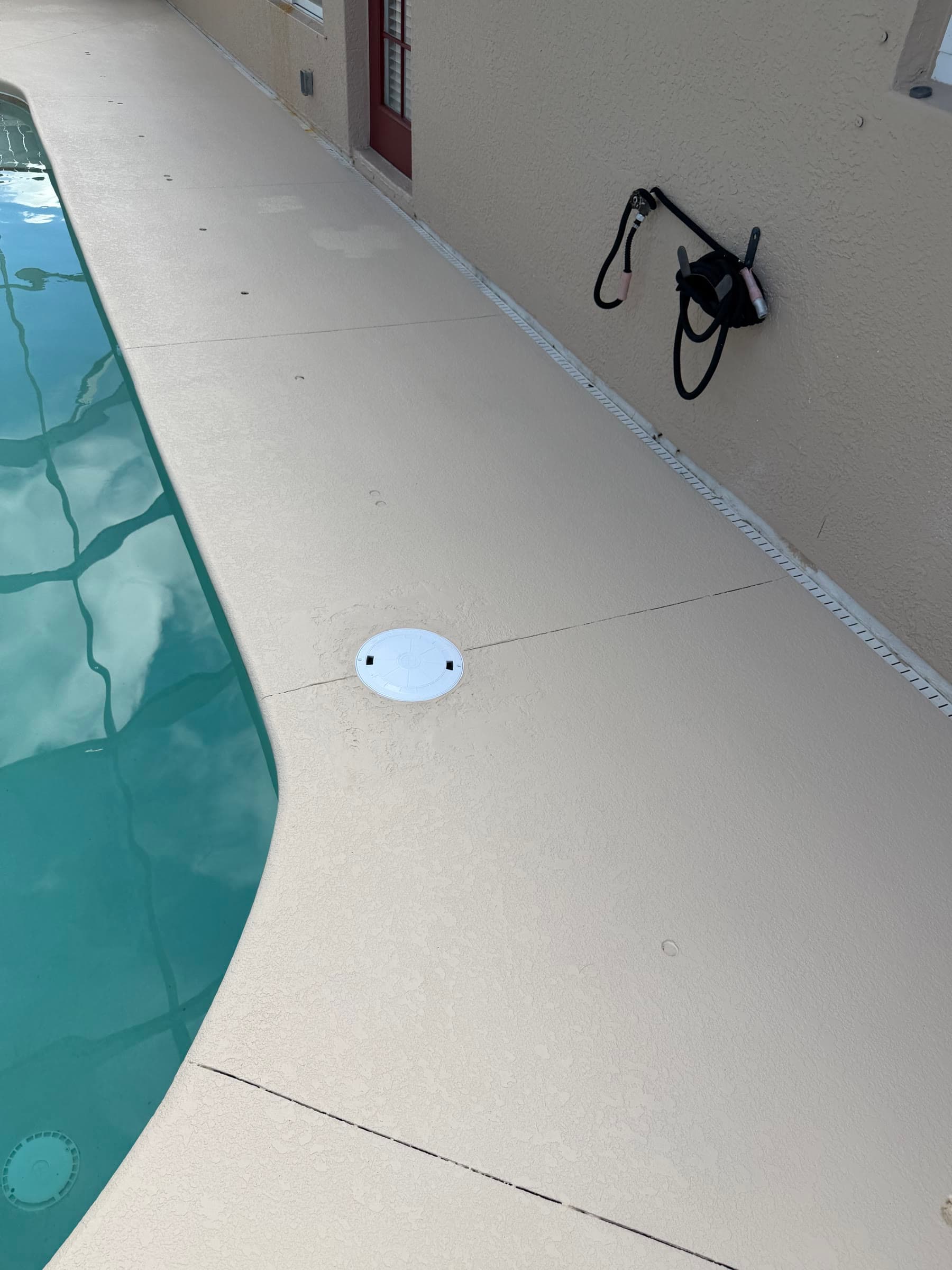 Completed pool-edge deck surface after exterior maintenance in Palm Bay FL