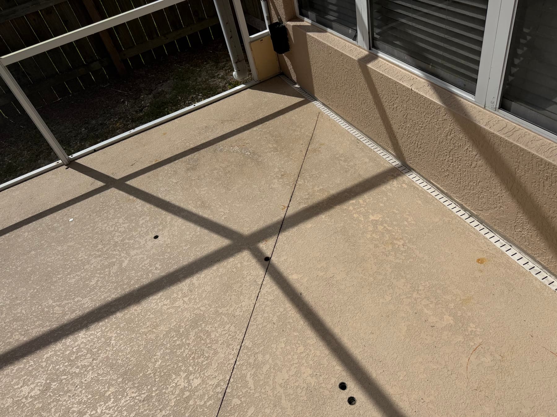 Worn screened pool-deck surface before preparation in Palm Bay FL